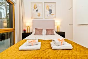 Posteľ alebo postele v izbe v ubytovaní BlueApart Verano Residence