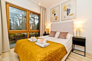 Posteľ alebo postele v izbe v ubytovaní BlueApart Verano Residence
