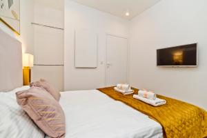Posteľ alebo postele v izbe v ubytovaní BlueApart Verano Residence
