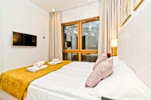 Posteľ alebo postele v izbe v ubytovaní BlueApart Verano Residence