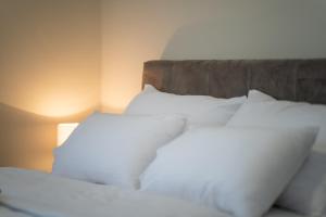 En eller flere senger på et rom på Onix Residence