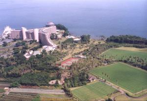 an aerial view of a resort next to the ocean at Ibusuki Iwasaki Hotel in Ibusuki