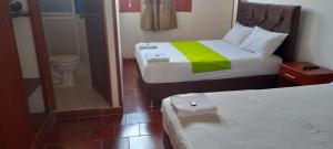 Postel nebo postele na pokoji v ubytování Posada San Luis