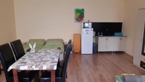 A kitchen or kitchenette at Bajusz Vendégház