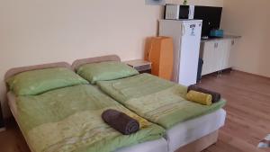 Bajusz Vendégház tesisinde bir odada yatak veya yataklar