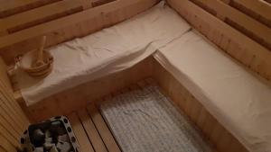 A bed or beds in a room at Bajusz Vendégház