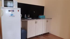 A kitchen or kitchenette at Bajusz Vendégház