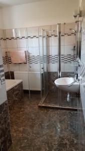 A bathroom at Bajusz Vendégház