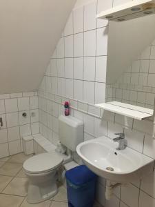 Ein Badezimmer in der Unterkunft Centrum Vendégház