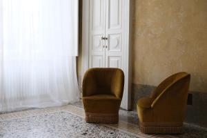 Posezení v ubytování Palazzo Albricci Peregrini