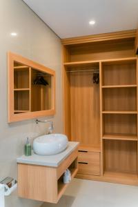 a bathroom with a sink and a shower at The Ume in Canggu
