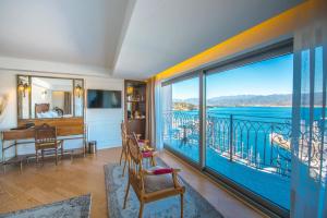 a room with a balcony with a view of the water at Casa Margot Hotel - Adults Only in Fethiye +161 photos