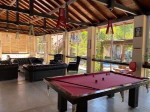 a living room with a pool table in it at La Delfina Island Resort in Tigre
