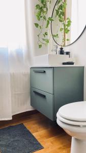 a bathroom with a sink and a mirror at Castelmenardo39 in Treviso