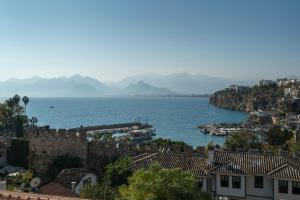 a view of a city and a body of water at Mavi Avlu - Old town apartments in Antalya