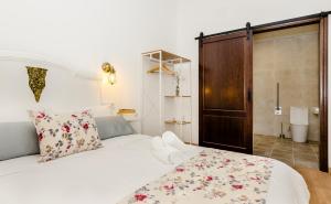 Postel nebo postele na pokoji v ubytování PALACIO Boutique