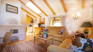 a living room with a couch and a table at Haus Jochbergerstrasse 116 in Kitzbühel