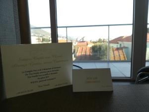 dos certificados sentados sobre una mesa con una ventana en Poggio Hotel, en Arenzano