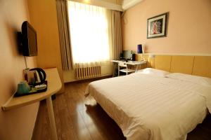 Postel nebo postele na pokoji v ubytování Beijing Sicily Hotel