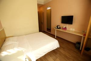 Postel nebo postele na pokoji v ubytování Beijing Sicily Hotel