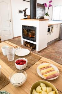 a table with some food on a counter in a kitchen at Almograve Beach Hostel in Almograve