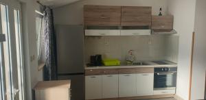 Kuchyň nebo kuchyňský kout v ubytování "Azzurra Apartments