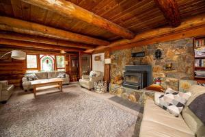 A seating area at Sitka Alpine Log Cabin