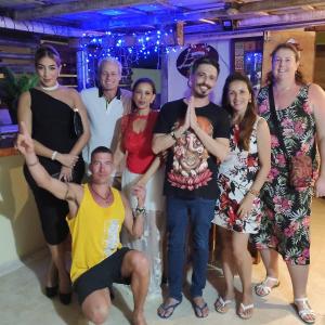 a group of people posing for a picture at a party at Hostel Eco Punta Cana in Punta Cana