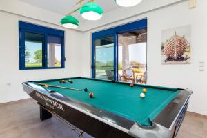 a billiard room with a pool table at The "Perfect Beach House" Villa in Lakhania