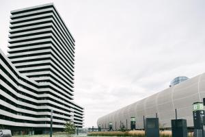 two tall buildings next to each other at Svarog Unique Apartment by CHORS in Bratislava +14 photos