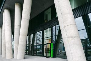 an external view of a building with columns at Svarog Unique Apartment by CHORS in Bratislava