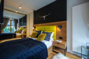 Posteľ alebo postele v izbe v ubytovaní Aparthotel Giewont