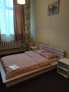 Postel nebo postele na pokoji v ubytování Mini Hotel na Gasheka