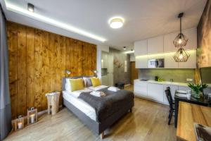 Posteľ alebo postele v izbe v ubytovaní Aparthotel Giewont