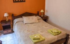 Una cama o camas en una habitación de Apart Hotel Monaco