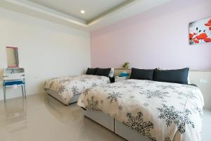 Letto o letti in una camera di 充電樁 羅東雲朵朵Cloud B&B免費洗衣機 烘衣機 近週三清溝 星巴克咖啡豆 國旅卡特約店