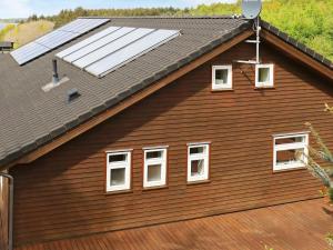 a house with solar panels on the roof at 8 person holiday home in Skals in Skals