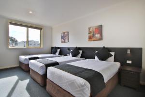 Postel nebo postele na pokoji v ubytování Comfort Hotel Dandenong