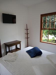 Postel nebo postele na pokoji v ubytování Pousada Cipó Paraty