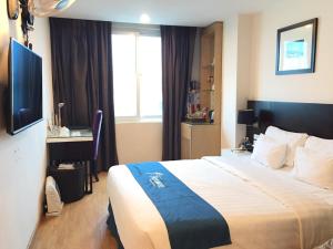 Giường trong phòng chung tại A25 Hotel - 66 Trần Thái Tông
