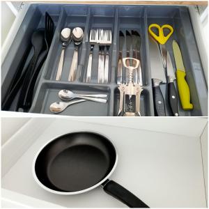a drawer filled with cooking utensils and a spatula at M&M Apartment VI Self CHECK-IN in Panevėžys