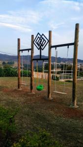a playground with a frisbee in a field at Pousada Morro dos Ventos in São João del Rei