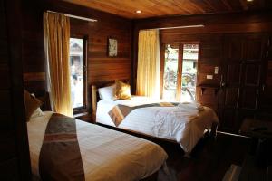 Cama o camas de una habitación en Burilamplai Resort บุรีลำปลาย รีสอร์ท