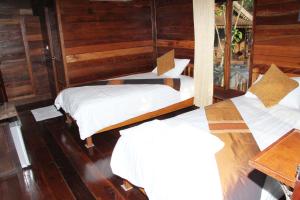 Cama o camas de una habitación en Burilamplai Resort บุรีลำปลาย รีสอร์ท