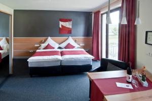 
Ein Bett oder Betten in einem Zimmer der Unterkunft Gästehaus und Weingut Bernd Frieden
