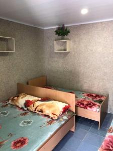 A bed or beds in a room at Astoria Hotel Kyrylivka