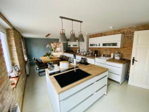 a kitchen with a sink and a counter top at Loft im Herzen der Stadt in Fürstenwalde