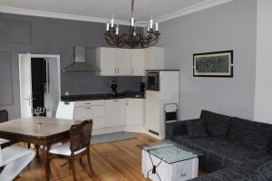 a living room with a couch and a table at Casa Hauth in Bernkastel-Kues