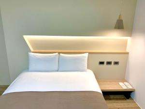 Postel nebo postele na pokoji v ubytování 日月潭五船民宿 5Boat B&B
