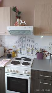 A kitchen or kitchenette at Bondareva Street Apartment